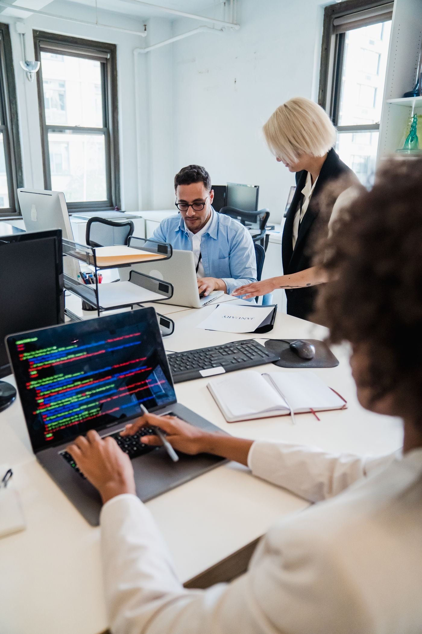 Software developers collaborating in a technology office